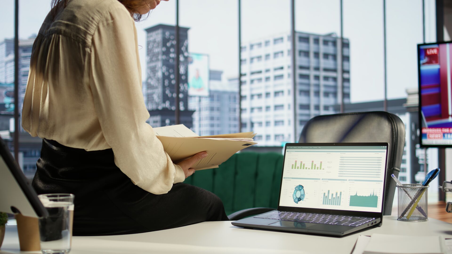 Ambitious woman CEO working in her modern corporate office, focusing on career development and maintaining a productive goal oriented work environment. Strategic thinking for growth. Camera B.